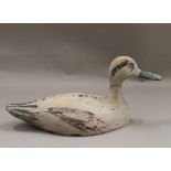 An antique decoy duck. 32.5 cm long.