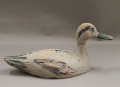 An antique decoy duck. 32.5 cm long.