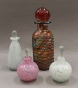 A Mdina glass decanter, signed; together with three perfume bottles with stoppers. The former 25.