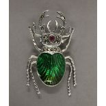 A silver dress brooch formed as a stag beetle. 4.75 cm long.
