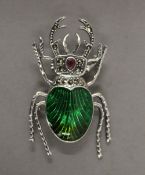 A silver dress brooch formed as a stag beetle. 4.75 cm long.