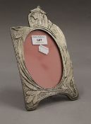 An Art Nouveau style photograph frame. 23 cm high.