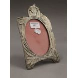 An Art Nouveau style photograph frame. 23 cm high.