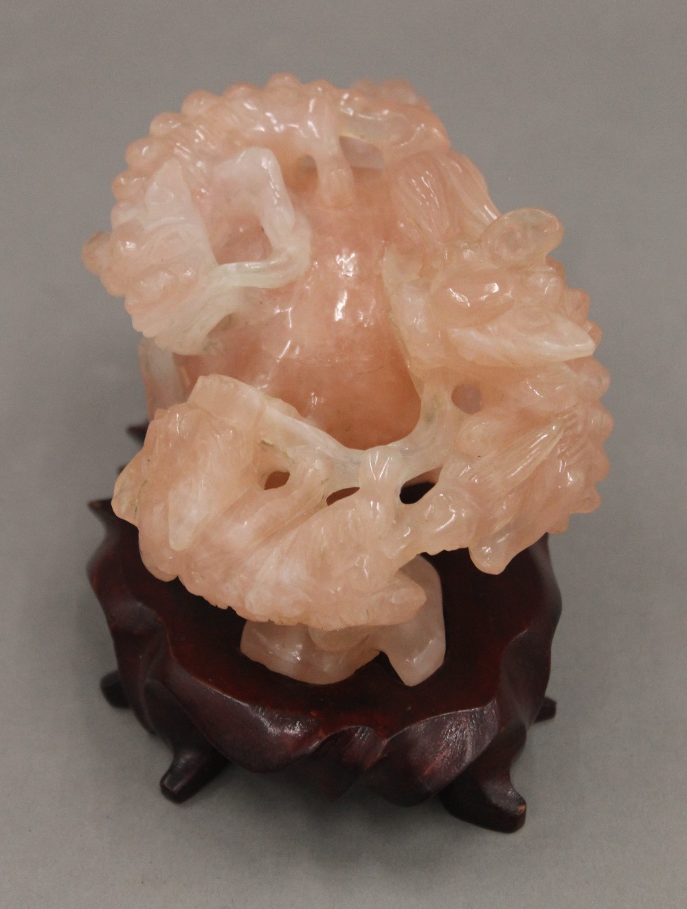 A Chinese carved rose quartz group formed as dogs-of-fo, on a carved wooden stand. - Image 3 of 5