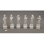 A set of six Continental porcelain cherubs. Each approximately 13 cm high.