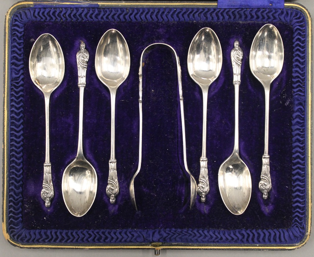 A cased set of silver apostle teaspoons and tongs. 3.2 troy ounces. - Image 2 of 10