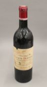 A single bottle of Chateau Lynch Moussas Grand Cru Classe 1959. 29 cm high.