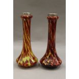 A pair of Victorian hand blown mottled glass vases with silver rims. 19 cm high.
