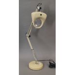 A vintage table anglepoise magnifier.
