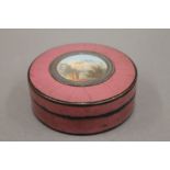 An 18th century circular snuff box, lid inset with a miniature. 7.5 cm diameter.