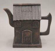 A Chinese Yixing teapot formed as a house. 12 cm high.