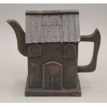 A Chinese Yixing teapot formed as a house. 12 cm high.