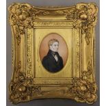 A 19th century gilt portrait miniature on ivory of a gentleman, framed and glazed.