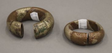 Two mixed metal money bracelets. The largest 9 cm wide.