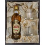 A boxed presentation set containing a bottle of William Grant's Family Reserve Finest Scotch Whisky