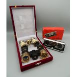 Three pairs of opera glasses/pocket binoculars.