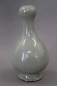 A Chinese celadon garlic neck vase. 28 cm high.