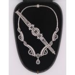 A profusely set 18 ct white gold diamond and sapphire necklace with drop pendant,