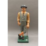 A modern golfer figure. 76.5 cm high.