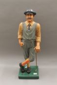 A modern golfer figure. 76.5 cm high.