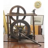 Two antique spinning wheels. The largest 75 cm long.