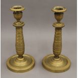 A pair of Empire style candlesticks. 22 cm high.