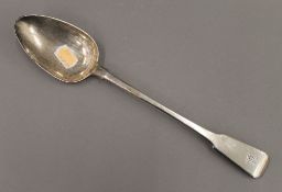 A Georgian silver basting spoon. 29 cm long. 3.8 troy ounces.