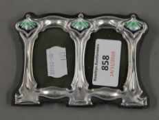 An Art Nouveau style silver double photograph frame. 11 cm wide.