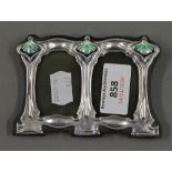 An Art Nouveau style silver double photograph frame. 11 cm wide.