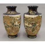 A pair of Japanese Satsuma vases. 25 cm high.