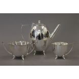 An Art Deco style silver plated tea set. 17 cm high.