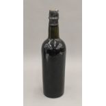 A single bottle of 1920 vintage port. 29 cm high.