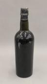 A single bottle of 1920 vintage port. 29 cm high.