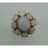 A 14 K gold and opal ring. Ring size N. 4.2 grammes total weight.