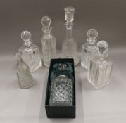 A quantity of cut crystal decanters, etc.