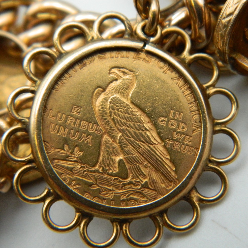 A 9 ct gold charm bracelet, set with various gold coins, including two sovereigns. 218. - Image 14 of 20