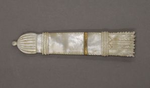 A 19th century mother-of-pearl needle case formed as a quiver of arrows. 9.5 cm long.