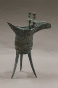 An archaic style Chinese bronze jue. 20.5 cm high.