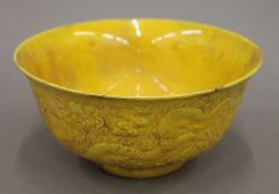 A Chinese yellow porcelain bowl. 15.5 cm diameter.