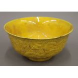 A Chinese yellow porcelain bowl. 15.5 cm diameter.