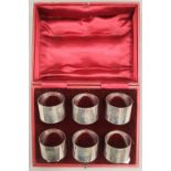 A cased set of six silver napkin rings. 7.9 troy ounces.