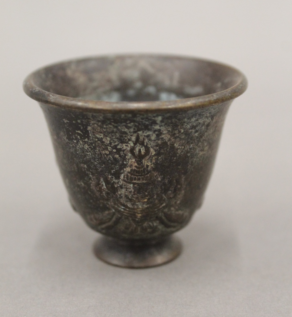 A small Chinese bronze cup. 4 cm high.