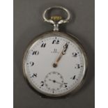 A silver Omega pocket watch. 4.75 cm diameter.