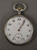 A silver Omega pocket watch. 4.75 cm diameter.