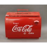 A Coca-Cola box. 43 cm wide.