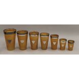 A cased set of seven silver rimmed horn beakers. 17 cm high.