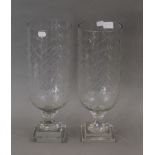 A pair of cut glass storm lamps. 40 cm high.