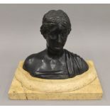 A 19th century patinated bronze bust, on marble socle base. 17 cm high.