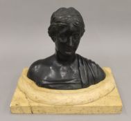 A 19th century patinated bronze bust, on marble socle base. 17 cm high.