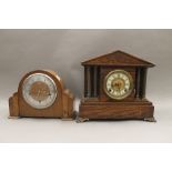 A Victorian oak mantle clock and another. The former 31.5 cm high.